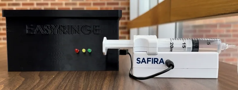 UF biomedical engineering students demonstrating the Easyringe voice-controlled syringe pump
