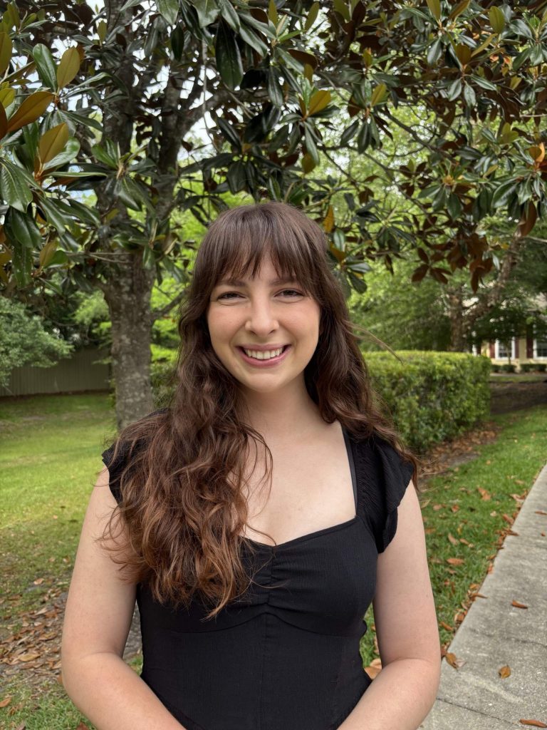 Julia Withrow, BME Ph.D. candidate, smiling in a park.