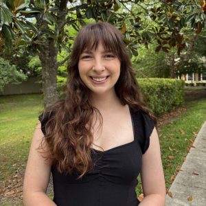 Julia Withrow, BME Ph.D. candidate, smiling in a park.