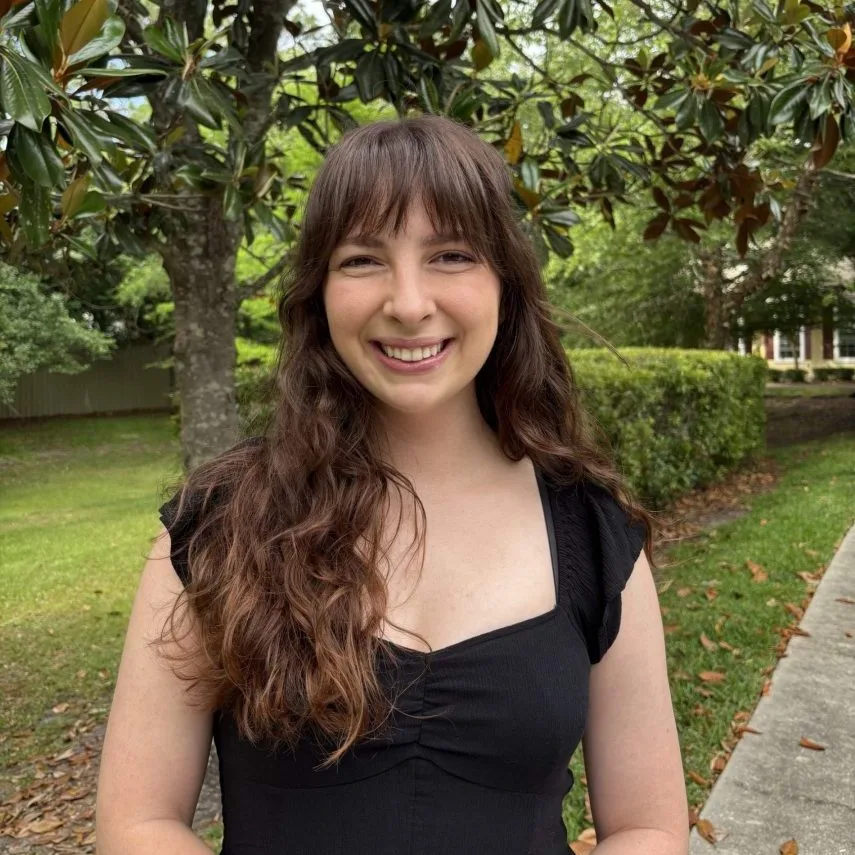 Julia Withrow, BME Ph.D. candidate, smiling in a park.