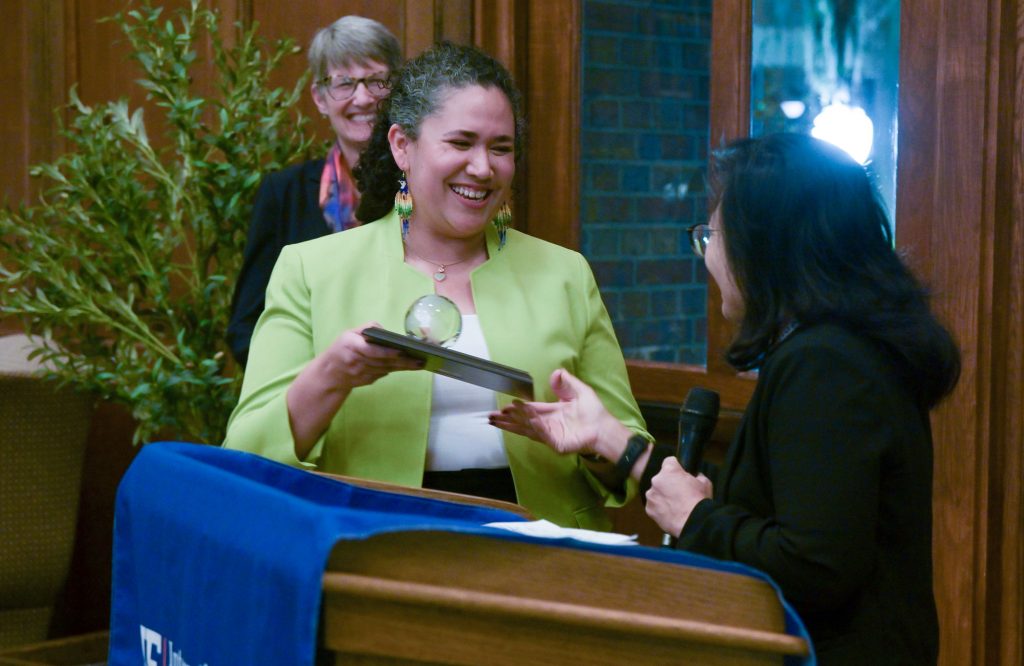 Biomedical Engineering Assistant Professor Ana Maria Porras accepts her International Educator of the Year Award, Junior Faculty, on Monday at the University of Florida.